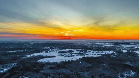 Aerial forward hyperlapse winter forest sunrise rural Latvia snow covered 스톡 동영상 331037616