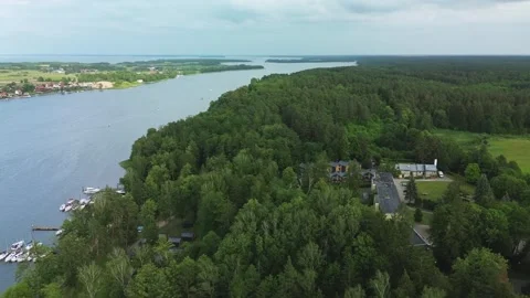 Aerial Forward Motion over Forest and Masurian Lake Stock Footage 311569529