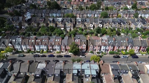 Aerial forward movement over terraced rooftops in Balham, London Stock Footage 340899653