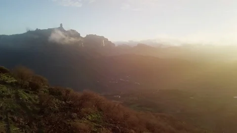 Aerial forward over valley towards a peak at sunset in Canary Islands 4K Video stock 101565931