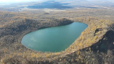 Aerial Forward Push Over Turquoise Volcanic Lake Arxan Stock Footage 330236147