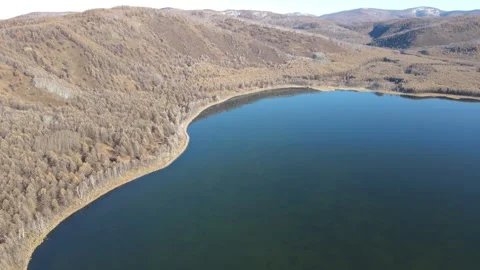 Aerial Forward Push Toward Arxan Heavenly Lake Autumn Inner Mongolia Stock Footage 330235872