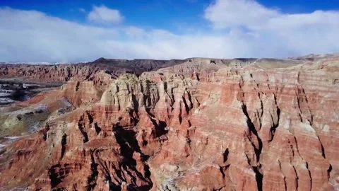Aerial Forward Shot Of Beautiful View Of Tranquil Brown Mountains Under Cloudy Stock Footage 223360367