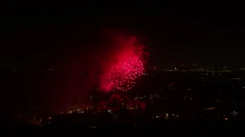 Aerial Forward Shot Of Fireworks Exploding At Night In City - Los Angeles, Stock Footage 169489577