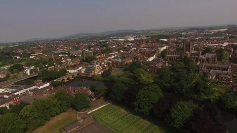 Aerial forward Shot of Hereford Cathedral and ancient bridge in 4K Video stock 76996400