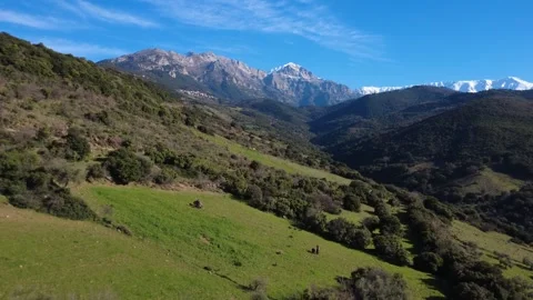 Aerial forward shot of mountain valley landscape with tourists and peaks Stock Footage 337459642