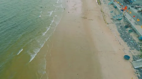 Aerial forward shot of Phuoc Hai beach with traditional basket boats, Vietnam Stock Footage 334452376