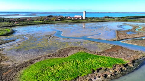 Aerial Forward Shot Of Structures On Island With Boats Against Sky During Sunny Stock Footage 249554173