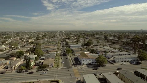 Aerial Forward Tilt Down Shot Of Residential Roofed Houses In City On Sunny Day Video stock 260433900
