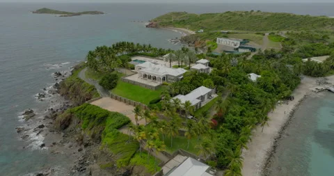 Aerial Forward Tilt Down Shot Of Villa On Top Of Epstein Island In Sea - VI, Stock-Footage 297726724