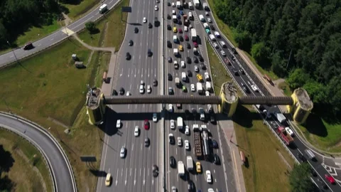 Aerial forward view of busy multilane road and forest corridor Stock Footage 321370224