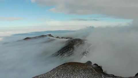 Aerial Forward View Over Snow Covered Mountain Stock Footage 168309920