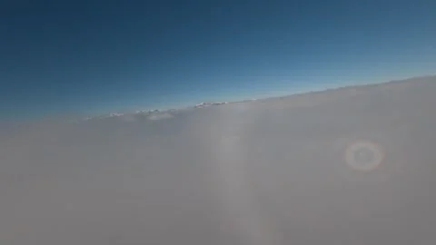 Aerial FPV Cloud Surfing Winter Wonderland Scenery, 4K Stock Footage 323465605