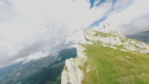 Aerial Fpv Drone Dive of cloudy Seceda hills in Italy Stock Footage 287004648