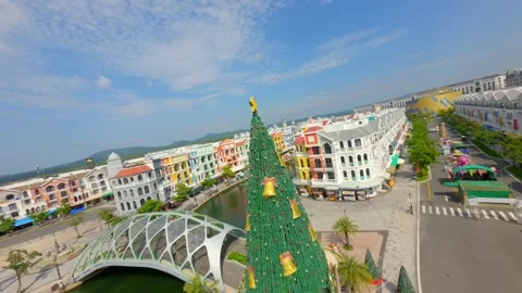 Aerial FPV drone flight over colorful European style waterfront town in Vietnam Stock Footage 325569391