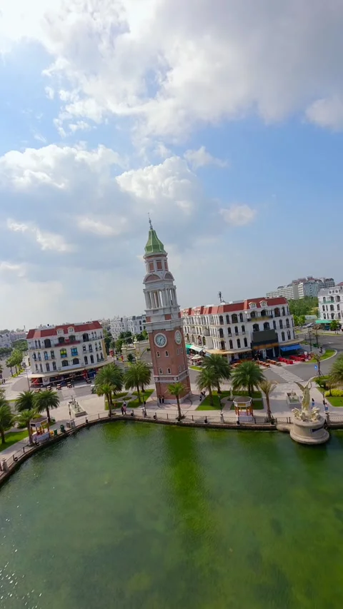Aerial FPV drone flight over colorful European style waterfront town in Vietnam Stock Footage 325569424