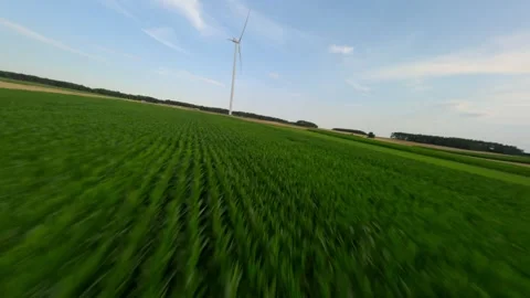 Aerial FPV Drone Flight Over Wind Turbines And Green Farm Fields Stock Footage 341702956