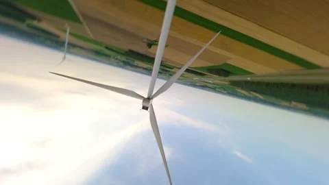 Aerial FPV Drone Roll Over Wind Turbine In Rural Landscape Stock Footage 341696093