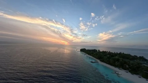 Aerial FPV Drone View of Crystal Clear Maldives Sea and Tropical Resort Stock Footage 342404060