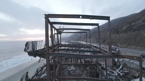 Aerial FPV Flythrough Burnt Structural Beams  Malibu Wildfire Destroyed Home Cal Stock Footage 302374414