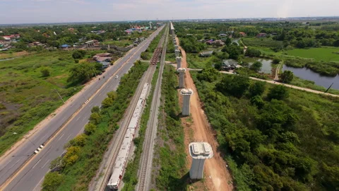 Aerial FPV Shot of Train and Elevated Railway Construction, Thailand Stock Footage 336811157