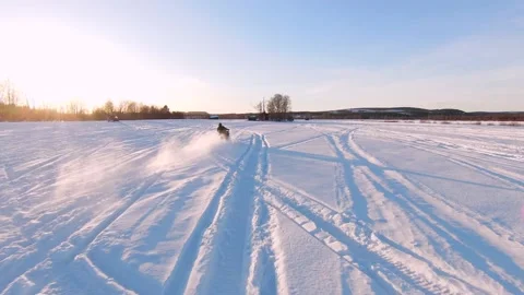 Aerial fpv view of a snowcat running on the snow in Overtornea, Sweden. Stock Footage 208838470