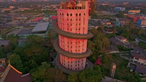 Aerial frame of Wat Sam Phran reflecting warm evening sky, Thailand Stock Footage 304374185