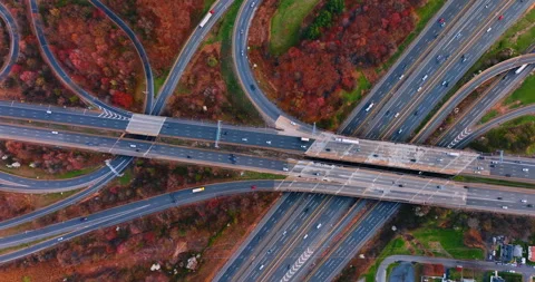 Aerial of a freeway interchange near dense suburban housing, New Jersey Stock Footage 335694576