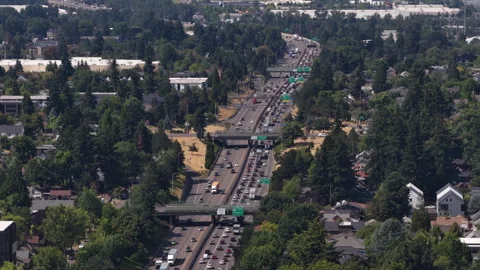 Aerial of freeway interchange through suburban neighborhood in Portland Oregon Stock Footage 339299246