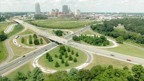 Aerial: Freeway traffic interchange and Winston-Salem, North Carolina, USA Stock Footage 149860296