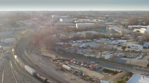 Aerial - freight train leaving intermodal rail terminal Stock Footage 147192634