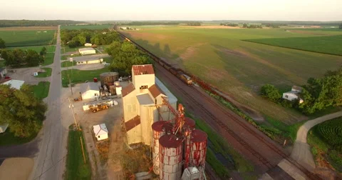 Aerial of freight train passing through the field in Kansas City 스톡 동영상 61768138