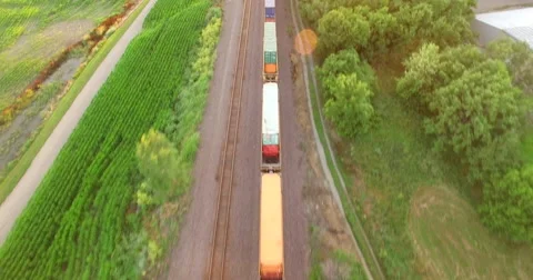 Aerial of freight train passing through the field in Kansas City 스톡 동영상 61768398