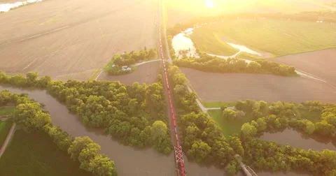 Aerial of freight train passing through the field in Kansas City Stock-Footage 61768590