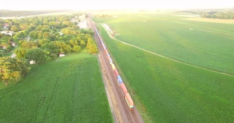 Aerial of freight train passing through the field in Kansas City 스톡 동영상 61769302