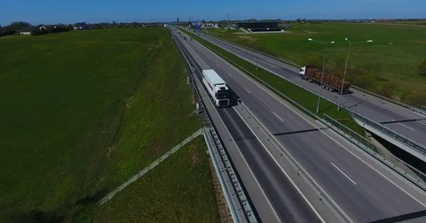 AERIAL: Freight truck transporting cargo container on a highway - 002 Stock Footage 75662425
