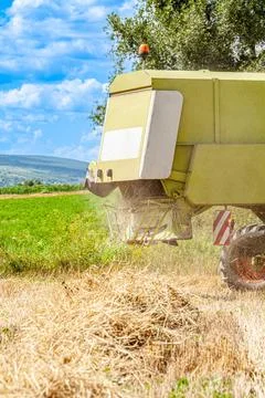 Aerial Front Side View of Burnt Combine Harvester on Grain Field with Telephone Stock Photos