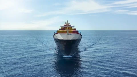 Aerial front tracking view of a medium sized container cargo vessel Stock Footage 294547652