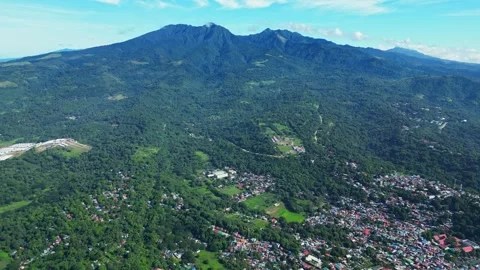 Aerial front view of Mount Mariveles in Bataan, showcasing its towering green Stock Footage 321717483