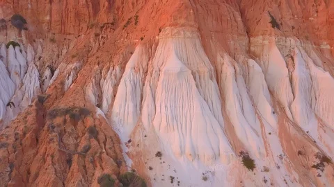 Aerial Front View of Red Mountain at the Beach Stock Footage 130067917