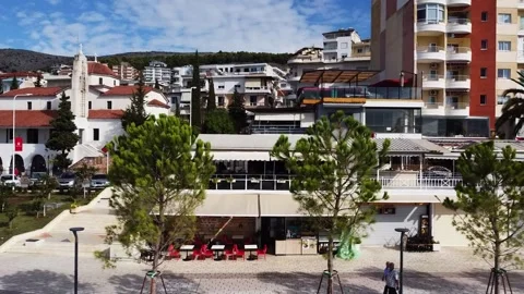 Aerial frontal view of the seafront of the Seaside City of Saranda, Albania 動画素材 194035184