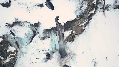 Aerial of frozen waterfall in winter by drone Stock Footage 117700853