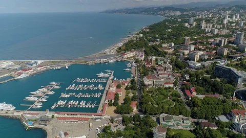 Aerial general plan Sochi cityscape Marine station lot of boats promenade Russia Stock Footage 122018860