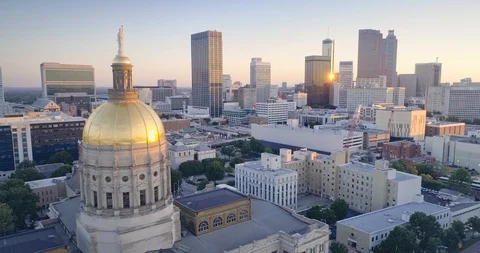 Aerial:  Georgia State Capitol and city skyline at sunrise Stock Footage