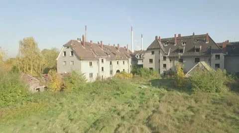Aerial of a ghosttown, slow ascent forward over meadow Stock Footage 59779665