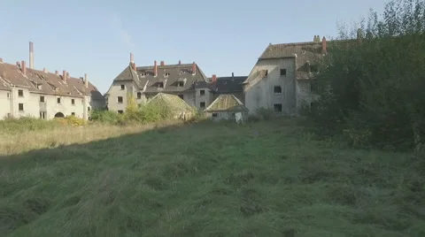 Aerial of a ghosttown,tracking shot forward over meadow Stock Footage 59780882