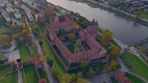 Aerial glide over Malbork Castle and Nogat River in Poland Stock Footage 320189152