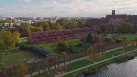 Aerial glide over Malbork Castle, Poland, with Nogat River views Stock Footage 320189518