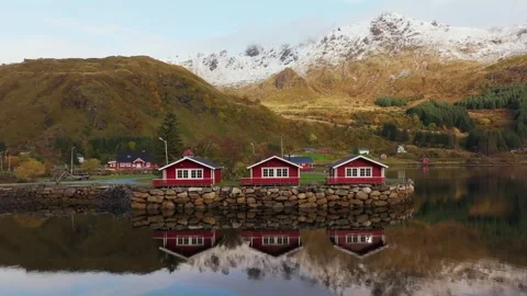 Aerial Glimpse of Typical Red Rorbu Fishing Huts with Sod Roofs in the Lofoten Stock Footage 254918505