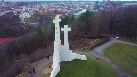Aerial going down the Three Crosses Monument revealing Vilnius in winter Stock Footage 328654943